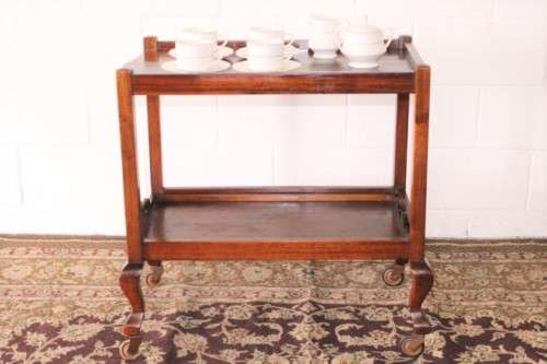 A wonderful solid Imbuia 2-tier tea/ drinks trolley with removable tray on its original castors