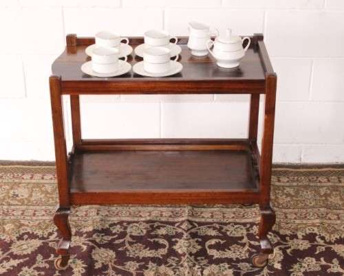 A wonderful solid Imbuia 2-tier tea/ drinks trolley with removable tray on its original castors