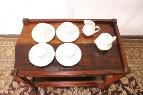 A wonderful solid Imbuia 2-tier tea/ drinks trolley with removable tray on its original castors