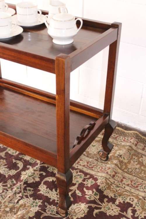 A wonderful solid Imbuia 2-tier tea/ drinks trolley with removable tray on its original castors
