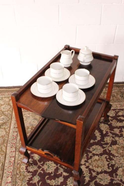 A wonderful solid Imbuia 2-tier tea/ drinks trolley with removable tray on its original castors