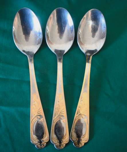 A 68-piece Edelstahl Rostfrei gold scroll trim flatware cutlery set in its original briefcase.