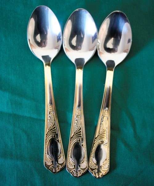 A 68-piece Edelstahl Rostfrei gold scroll trim flatware cutlery set in its original briefcase.