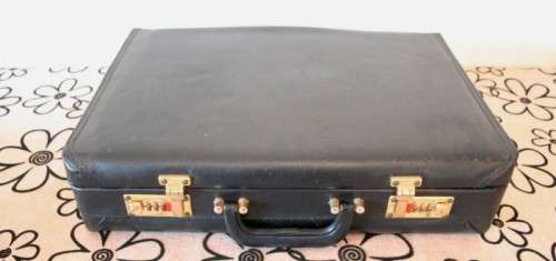 A 68-piece Edelstahl Rostfrei gold scroll trim flatware cutlery set in its original briefcase.
