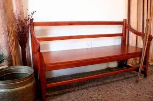 A wonderful well-made, sturdy vintage three seater  wood bench - perfect  in a lapa/ patio!