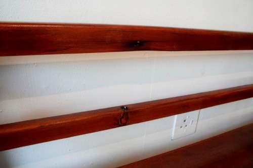 A wonderful well-made, sturdy vintage three seater  wood bench - perfect  in a lapa/ patio!