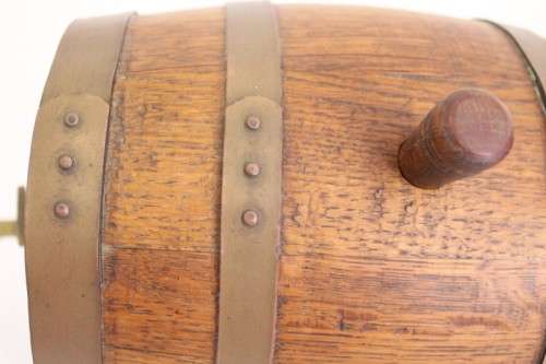 A fantastic and very well made miniature solid oak whiskey barrel on a stand w/ brass tap & stopper