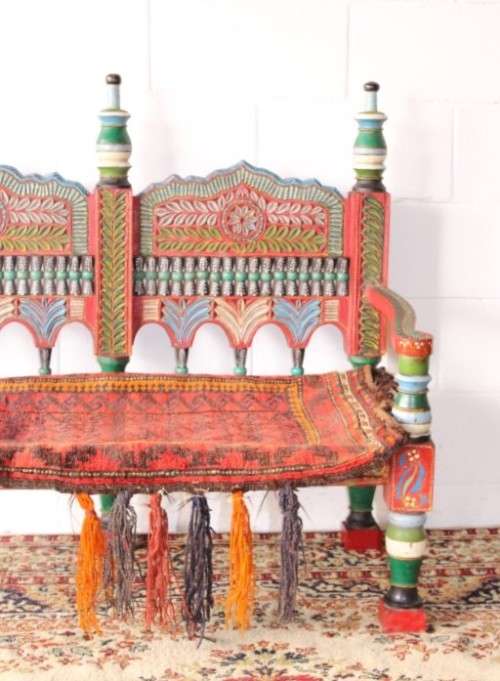 A rare antique brightly coloured wedding seat from the Swati Valley in Pakistan w/ a Persian cushion