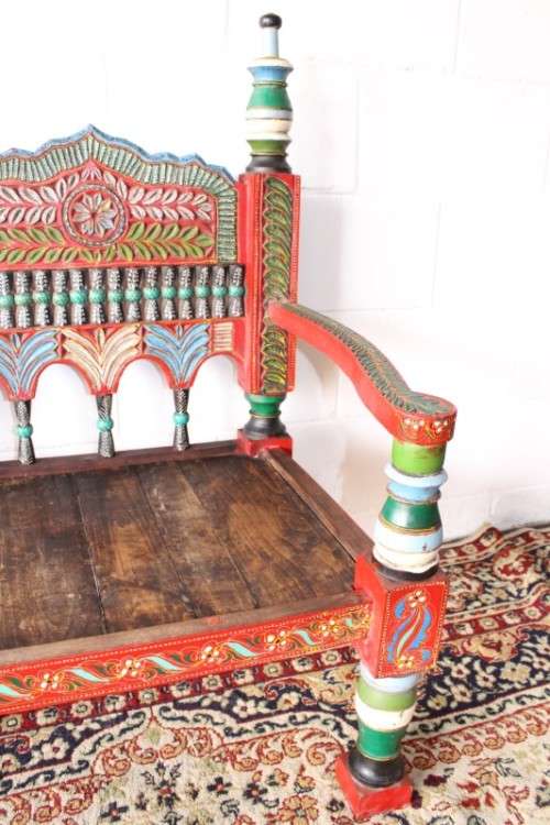 A rare antique brightly coloured wedding seat from the Swati Valley in Pakistan w/ a Persian cushion