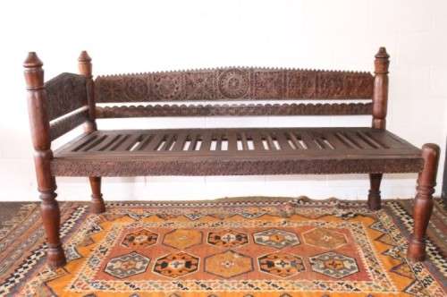 A stunningly hand carved cedar wood vintage Pakistani Charpoi day bed/ bench from the Swati Valley