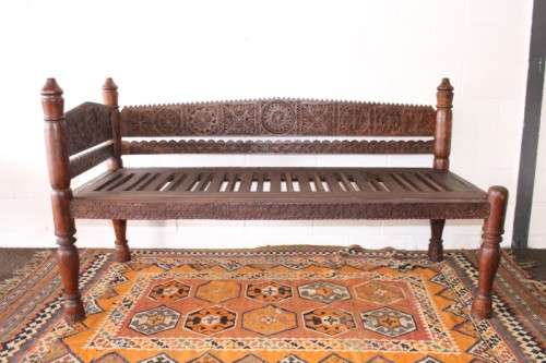 A stunningly hand carved cedar wood vintage Pakistani Charpoi day bed/ bench from the Swati Valley