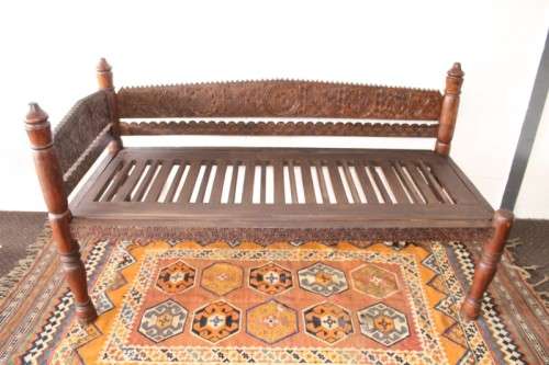 A stunningly hand carved cedar wood vintage Pakistani Charpoi day bed/ bench from the Swati Valley