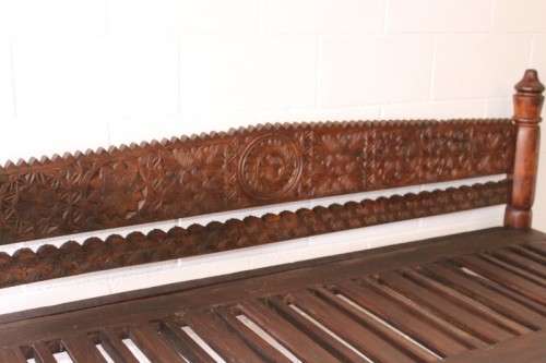 A stunningly hand carved cedar wood vintage Pakistani Charpoi day bed/ bench from the Swati Valley