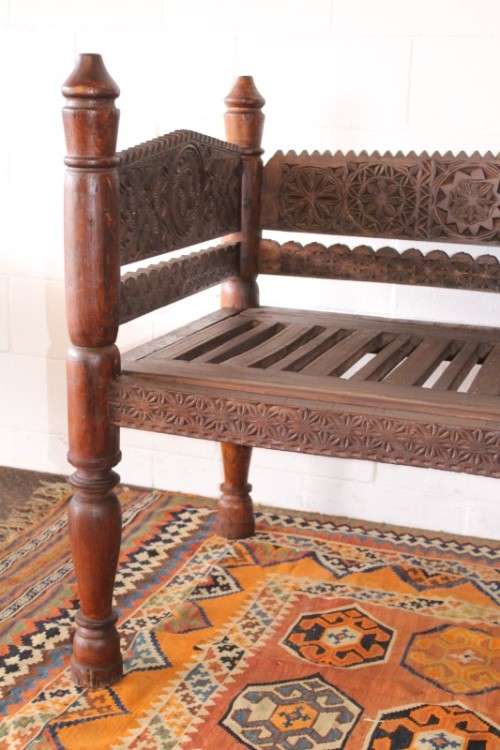 A stunningly hand carved cedar wood vintage Pakistani Charpoi day bed/ bench from the Swati Valley