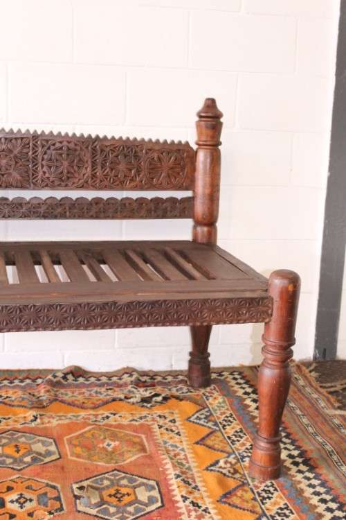 A stunningly hand carved cedar wood vintage Pakistani Charpoi day bed/ bench from the Swati Valley