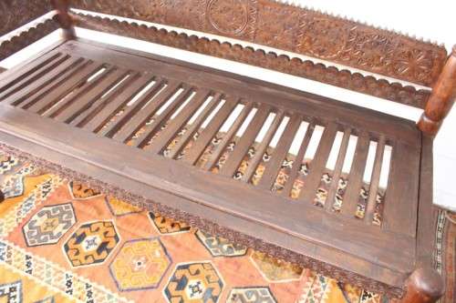 A stunningly hand carved cedar wood vintage Pakistani Charpoi day bed/ bench from the Swati Valley