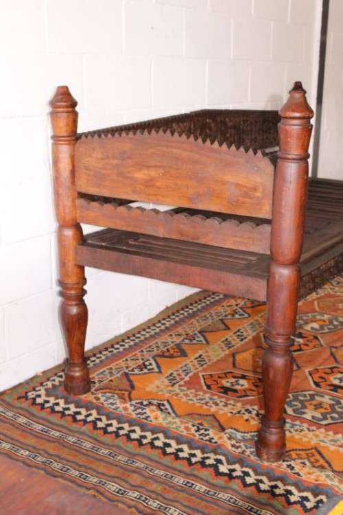 A stunningly hand carved cedar wood vintage Pakistani Charpoi day bed/ bench from the Swati Valley