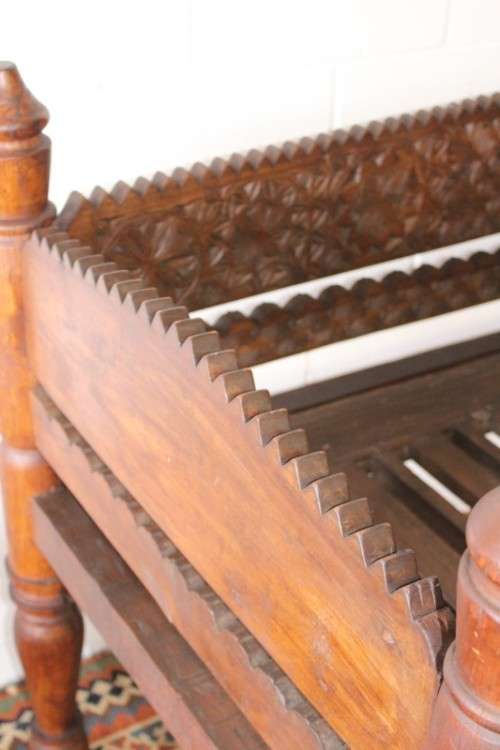 A stunningly hand carved cedar wood vintage Pakistani Charpoi day bed/ bench from the Swati Valley
