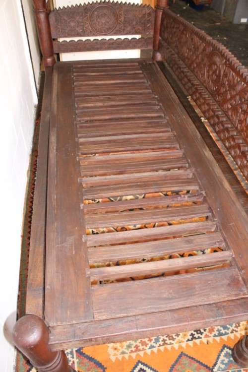 A stunningly hand carved cedar wood vintage Pakistani Charpoi day bed/ bench from the Swati Valley