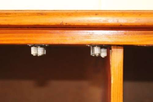 A solidly made double door SA pine storage cabinet with an array of shelves and storage space