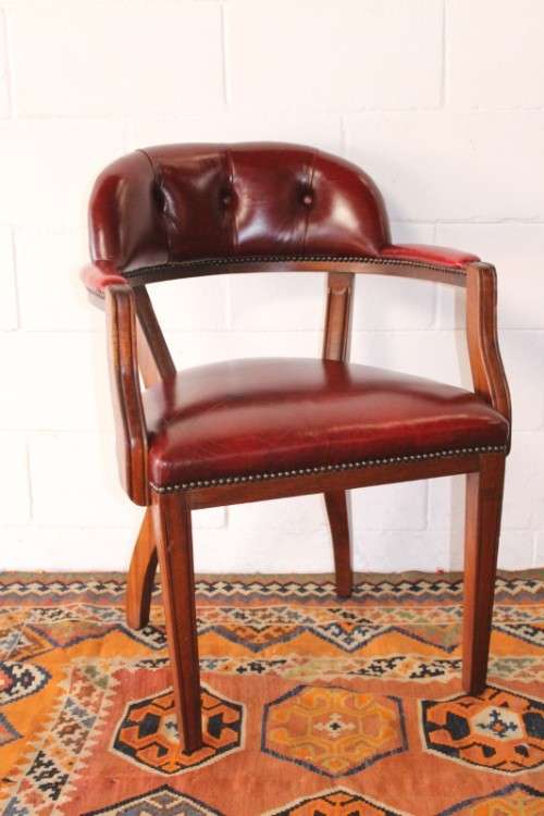 **RS17** A pair of vintage chateau-red leather visitors/ occasional armchairs w/ deep button backs