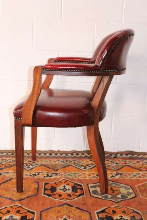 **RS17** A pair of vintage chateau-red leather visitors/ occasional armchairs w/ deep button backs