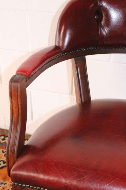 **RS17** A pair of vintage chateau-red leather visitors/ occasional armchairs w/ deep button backs