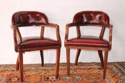 **RS17** A pair of vintage chateau-red leather visitors/ occasional armchairs w/ deep button backs