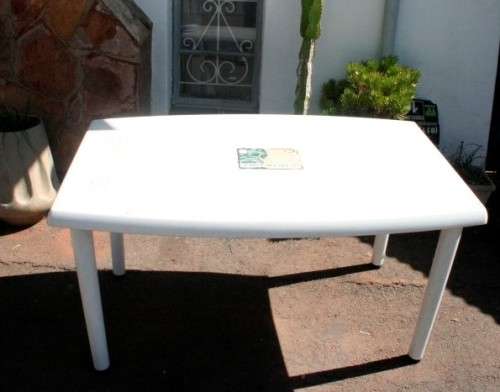 A sturdy white plastic six seater table perfect for a garden, patio/ lapa etc