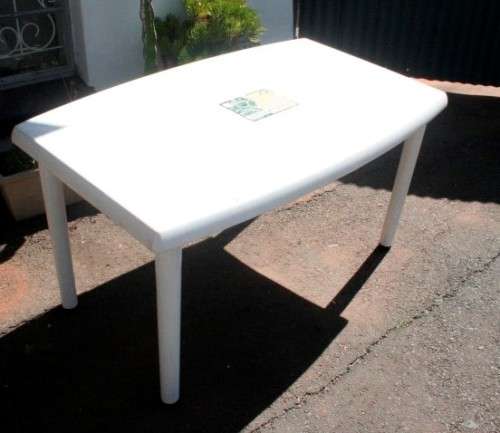 A sturdy white plastic six seater table perfect for a garden, patio/ lapa etc