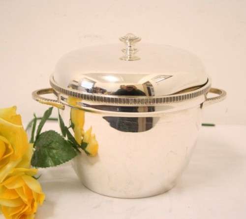 A  lovely double-handle EPNS made in England ice bucket with lovely clean lines.