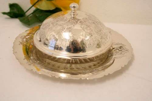 A gorgeous vintage silver plated lidded breakfast butter dish with an ornate lid and glass dish.