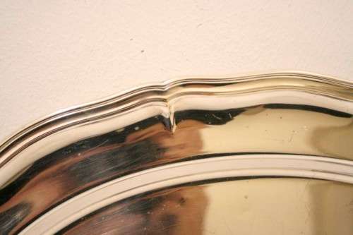 A gorgeous large silver plated platter with an elegant design.