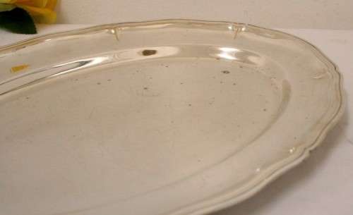 A gorgeous large silver plated platter with an elegant design.