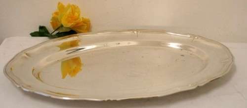 A gorgeous large silver plated platter with an elegant design.