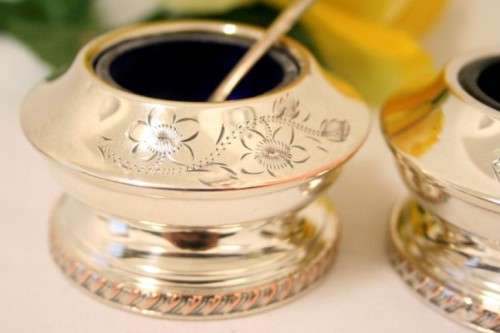 A set of gorgeous EPNS silver plated mustard pots with cobalt blue glass bowls and a spoon.