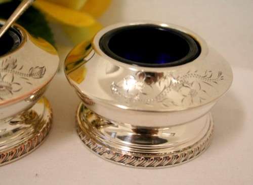 A set of gorgeous EPNS silver plated mustard pots with cobalt blue glass bowls and a spoon.
