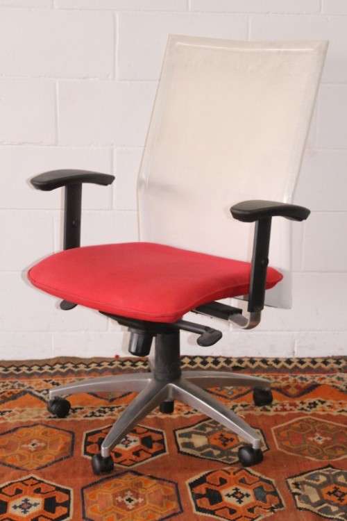 A modern styled red and white office chair with tilt, height and tension adjusters