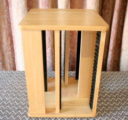 A wonderful wooden rotating table top CD stand with space for approximately 80x CD's