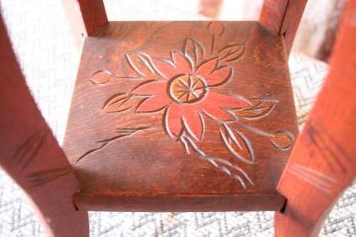 A gorgeous carved round occasional/ side table w/ painted detail on the top and bottom shelf base.