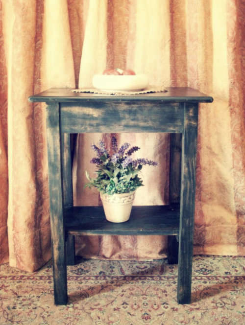 A good, well made solid wood occasional table with a rustic gold paint technique. Lifespace Sale