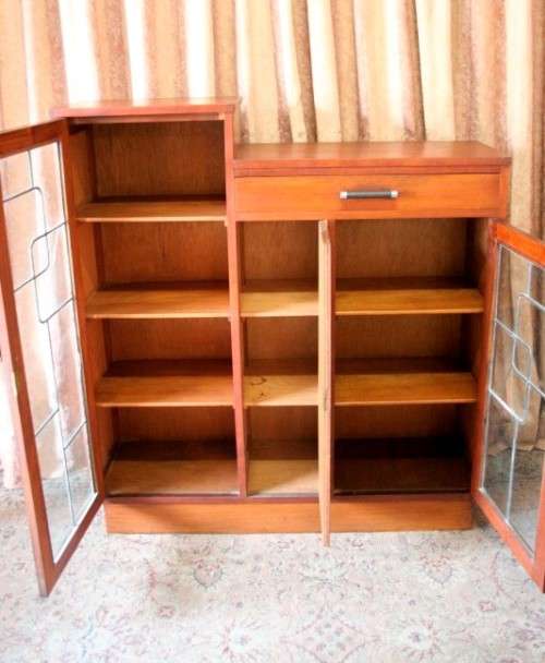 A fantastic solid Teak display cabinet w lead glass doors & large cupboards.