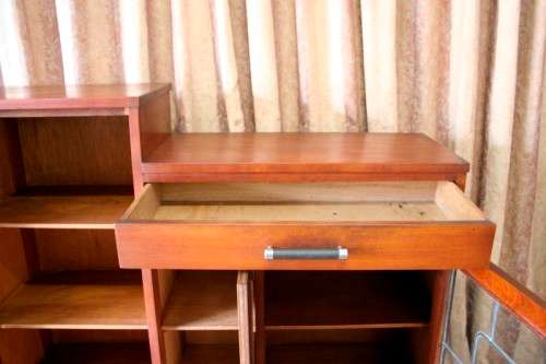 A fantastic solid Teak display cabinet w lead glass doors & large cupboards.