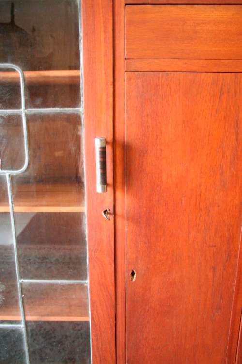 A fantastic solid Teak display cabinet w lead glass doors & large cupboards.