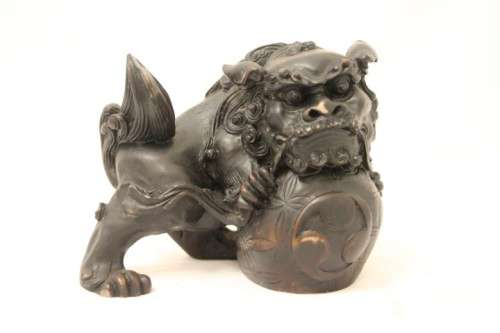 An awesome black oriental resin foo dog/ temple lion ornament