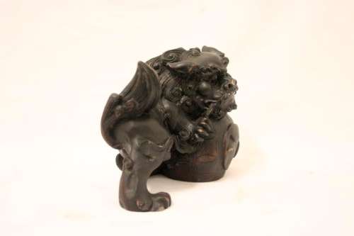 An awesome black oriental resin foo dog/ temple lion ornament