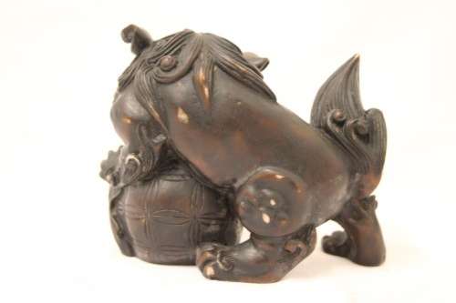An awesome black oriental resin foo dog/ temple lion ornament