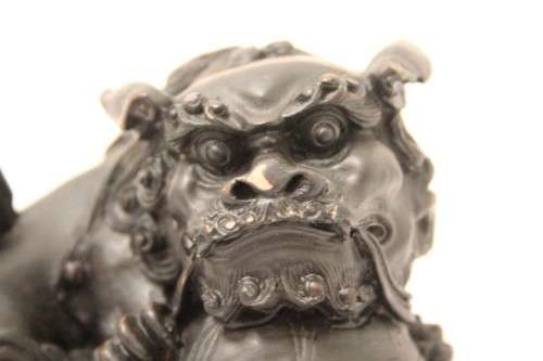 An awesome black oriental resin foo dog/ temple lion ornament