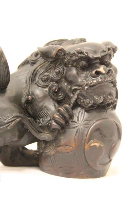 An awesome black oriental resin foo dog/ temple lion ornament
