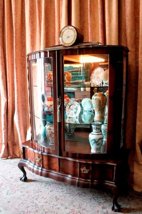 An exquisite ball & claw 2 glass door show cabinet w/ 2 bottom drawers, light and brass handles!!